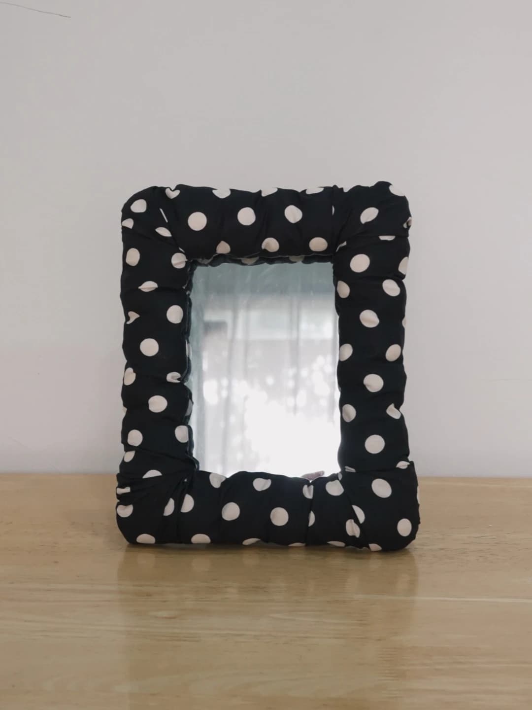 black dot mirror
